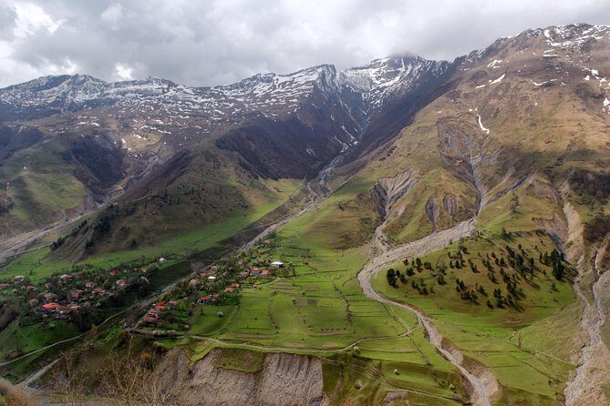 Adventure in Caucasus – Private Tour to Jinvali, Ananuri, Gudauri, Kazbegi - Stop 3: Friendship Monument on the Military Highway and the Paragliding Moment